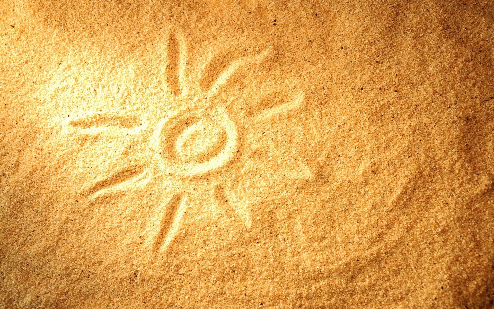 drawing in the sand the sun heat sand