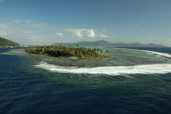 Waves and foam around the island