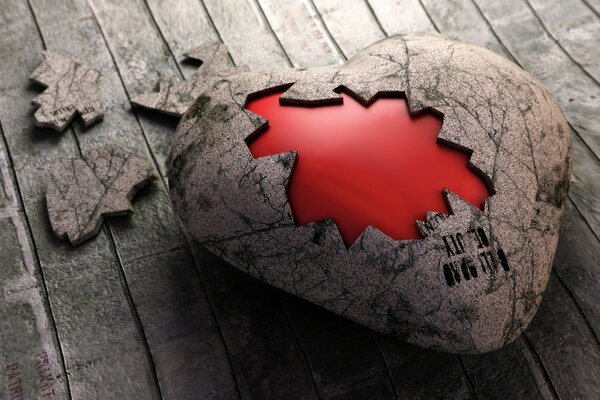 A heart in a shell on a wooden floor