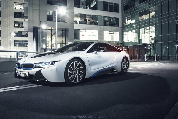 White BMW in night lighting