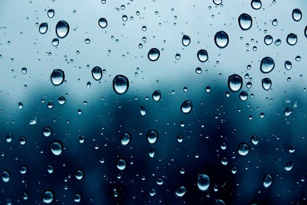 Water droplets scattered on transparent glass