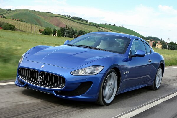 Blue Maserati granturismo at speed