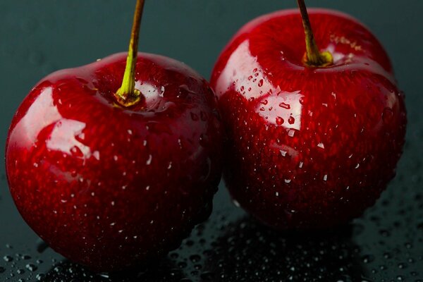 Cherry berry fruits with water drops in magnification