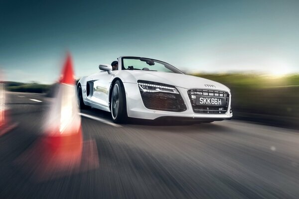 Convertible white Audi rushes