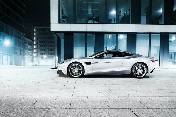 Aston Martin car in the middle of the city at night