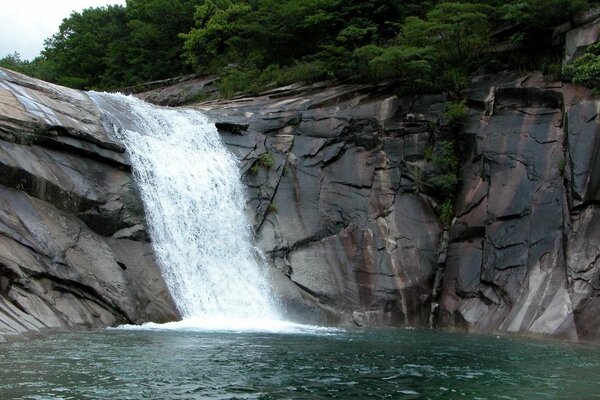 Waterfall among rocky rocks