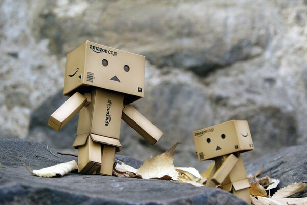 Cute cardboard men play enthusiastically