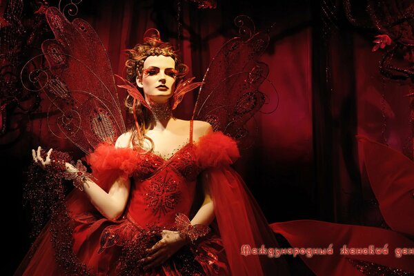 Glamorous chic girl in red at a masquerade