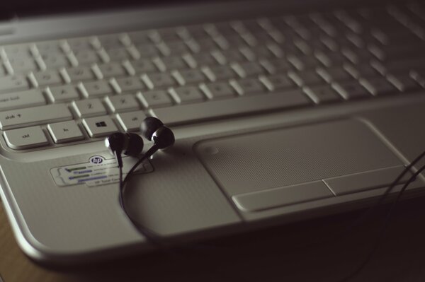 A great laptop with headphones and keyboard