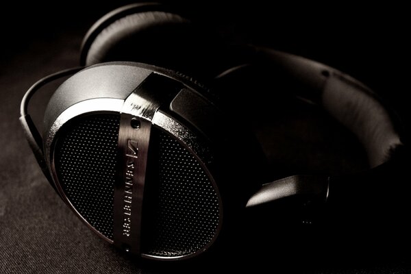 Headphones on a dark background with steep dimming