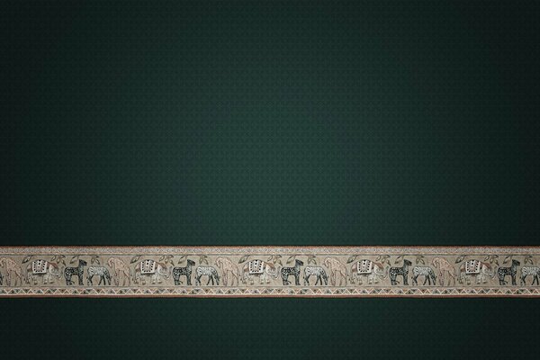A strip of animal ornament on a dark background