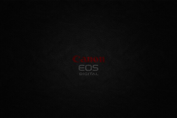 Dark desktop wallpaper with Canon logo