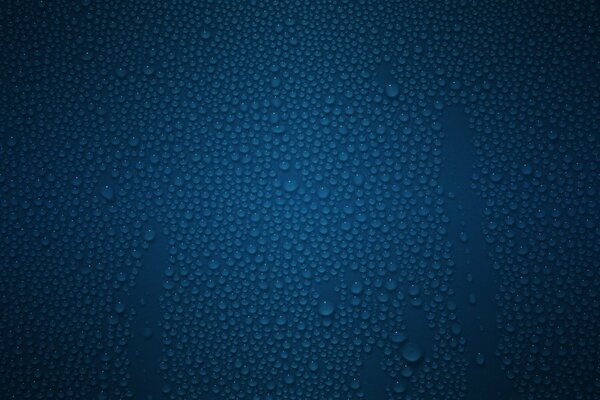 Water droplets on a blue surface