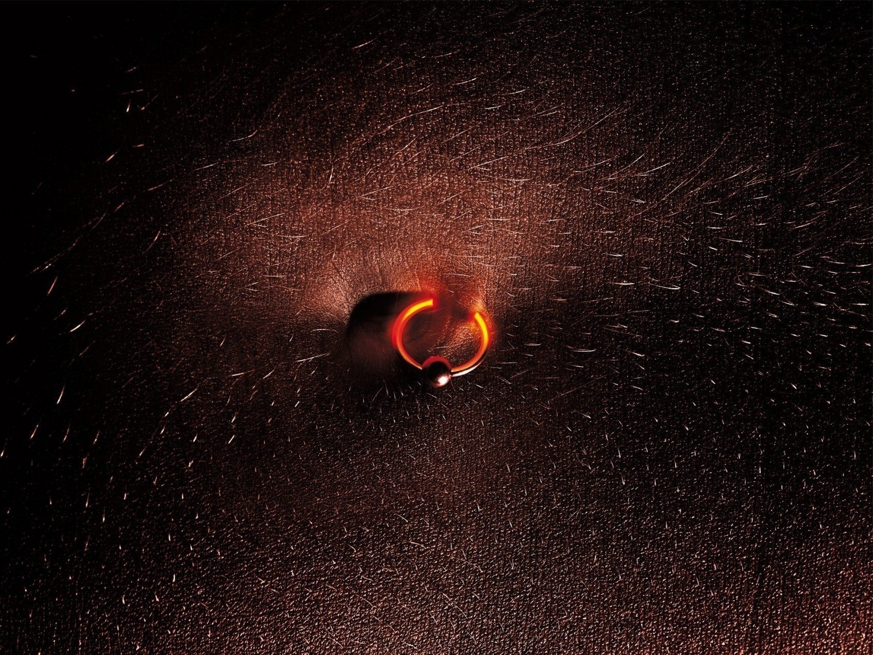 glowing earring puncture skin sparks macro hairs navel piercing