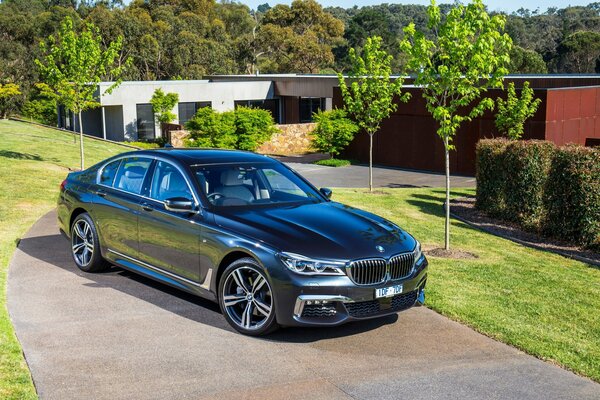 Black BMW 7 series sedan on a beautiful background