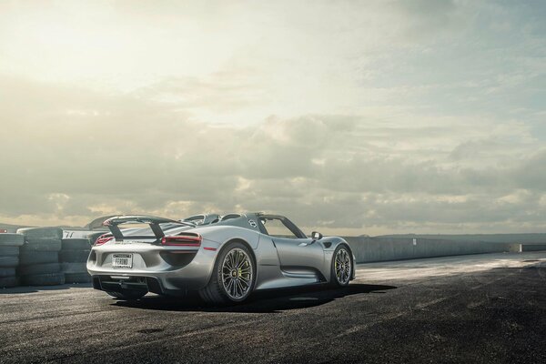 Silver sports car against the sky