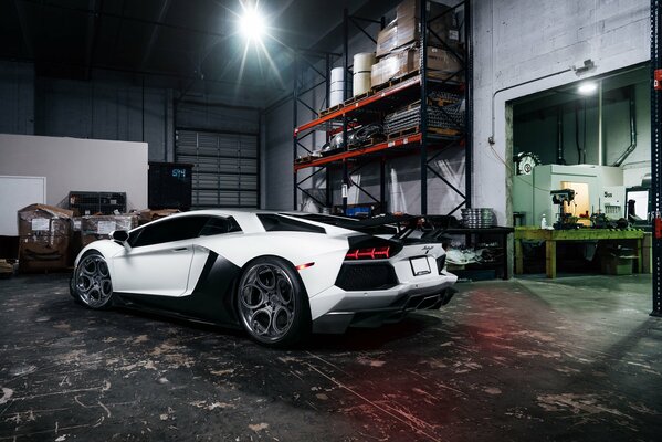 Tuning in a white Lamborghini garage