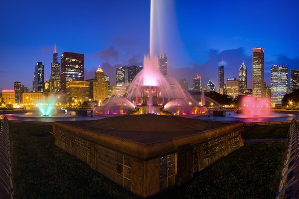 Night fountain on the background of skyscrapers in Chicago