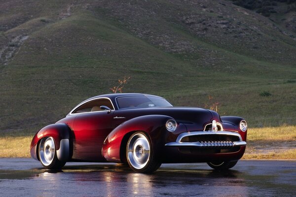 Retro car concept on a mountain background