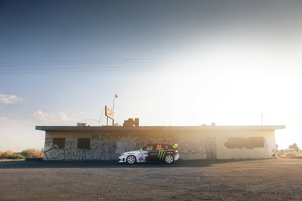 Subaru on the background of graffiti side view