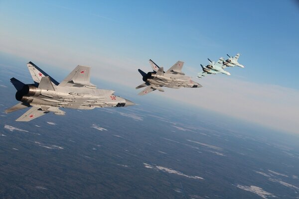 Flying fighters in the sky above the ground