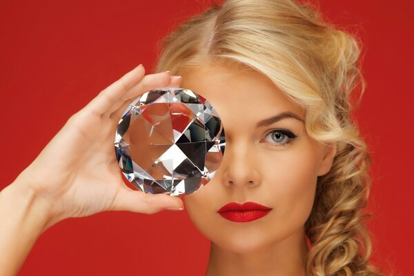 A girl with red lipstick and a big diamond