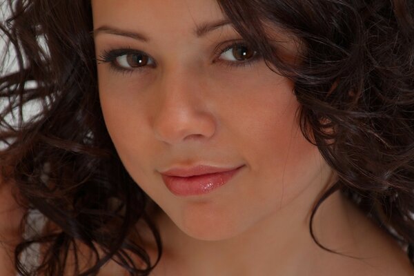 Beautiful brown-eyed girl with curly hair