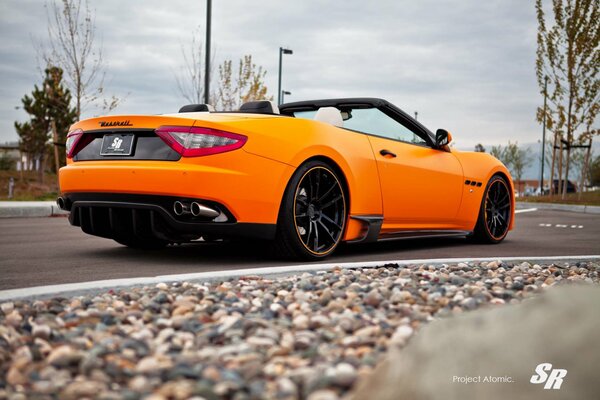 And I ll get into an orange Maserati v-8 convertible