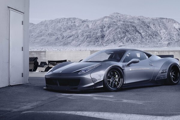 Tuned Ferrari on the background of mountains