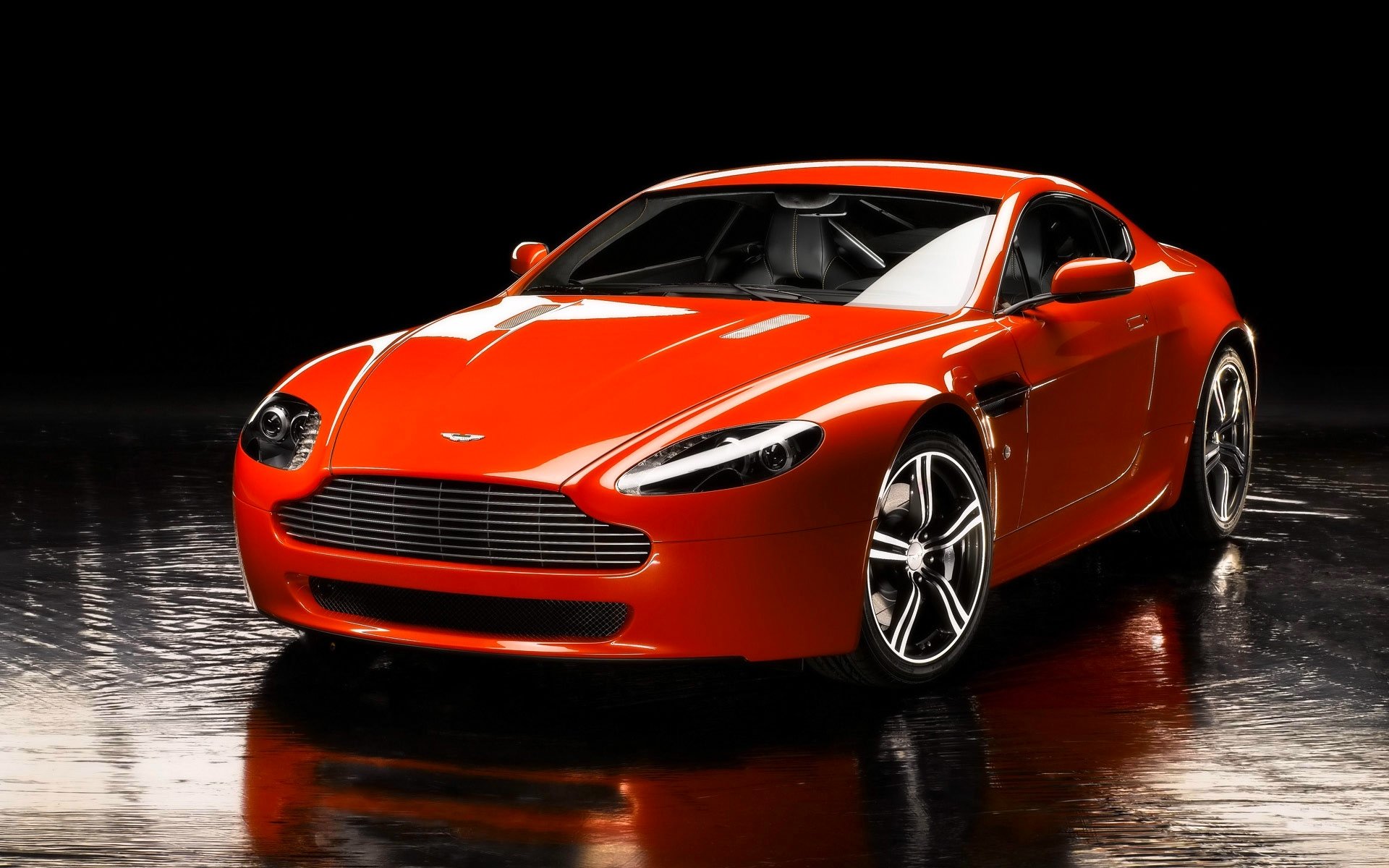 aston martin v8 vantage machine front sports car orange reflection