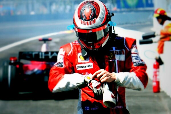 Formula 1 Championship. A racer in uniform