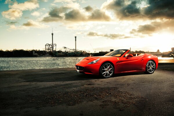 Ferrari California car on the pier by the river