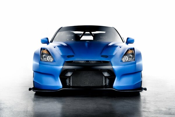 There is a beautiful blue car