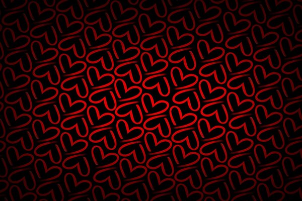 Texture with red hearts on a dark background