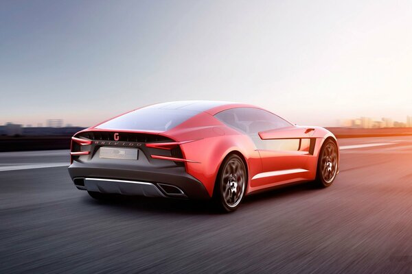 Red super car at speed on the road