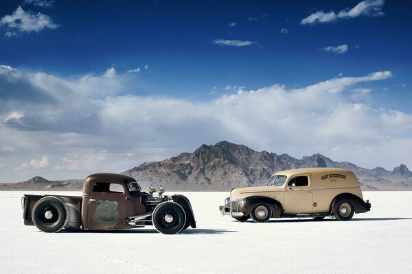Two old men in the desert with clouds