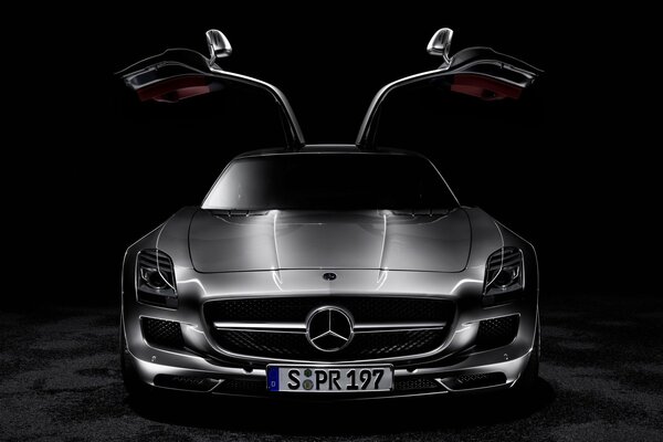 Silver mersedes with open doors