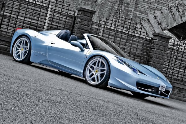 Blue tuned car at the fence