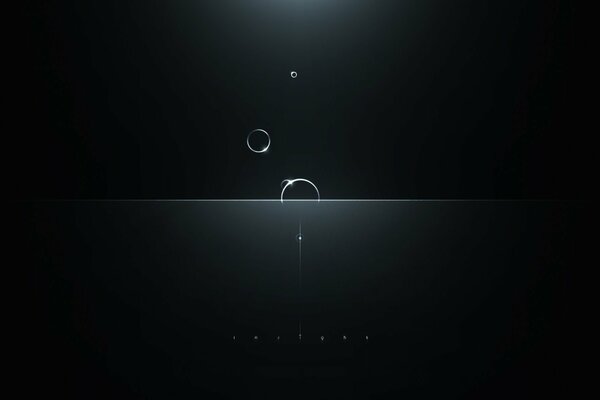 Falling luminous transparent circles on a black background