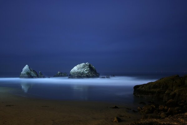 Standing lonely rocks in the sea