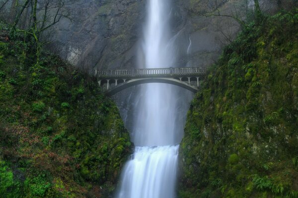 Bridge over the waterfall. Green Rocks