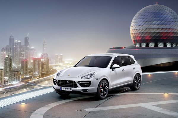 White porsche cayenne near the helipad