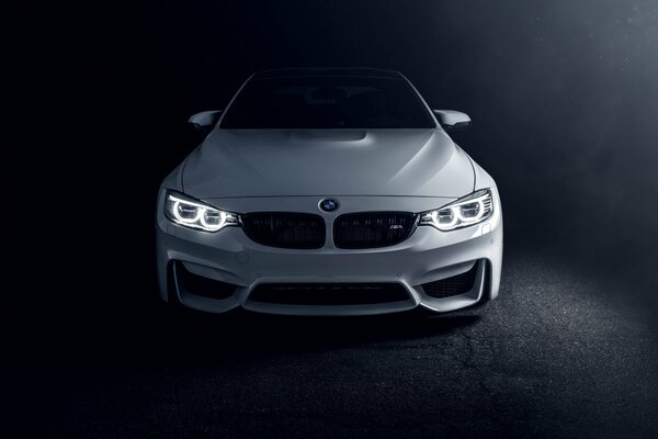 In front of a white BMW