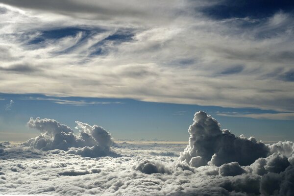 Curly clouds in the blue sky