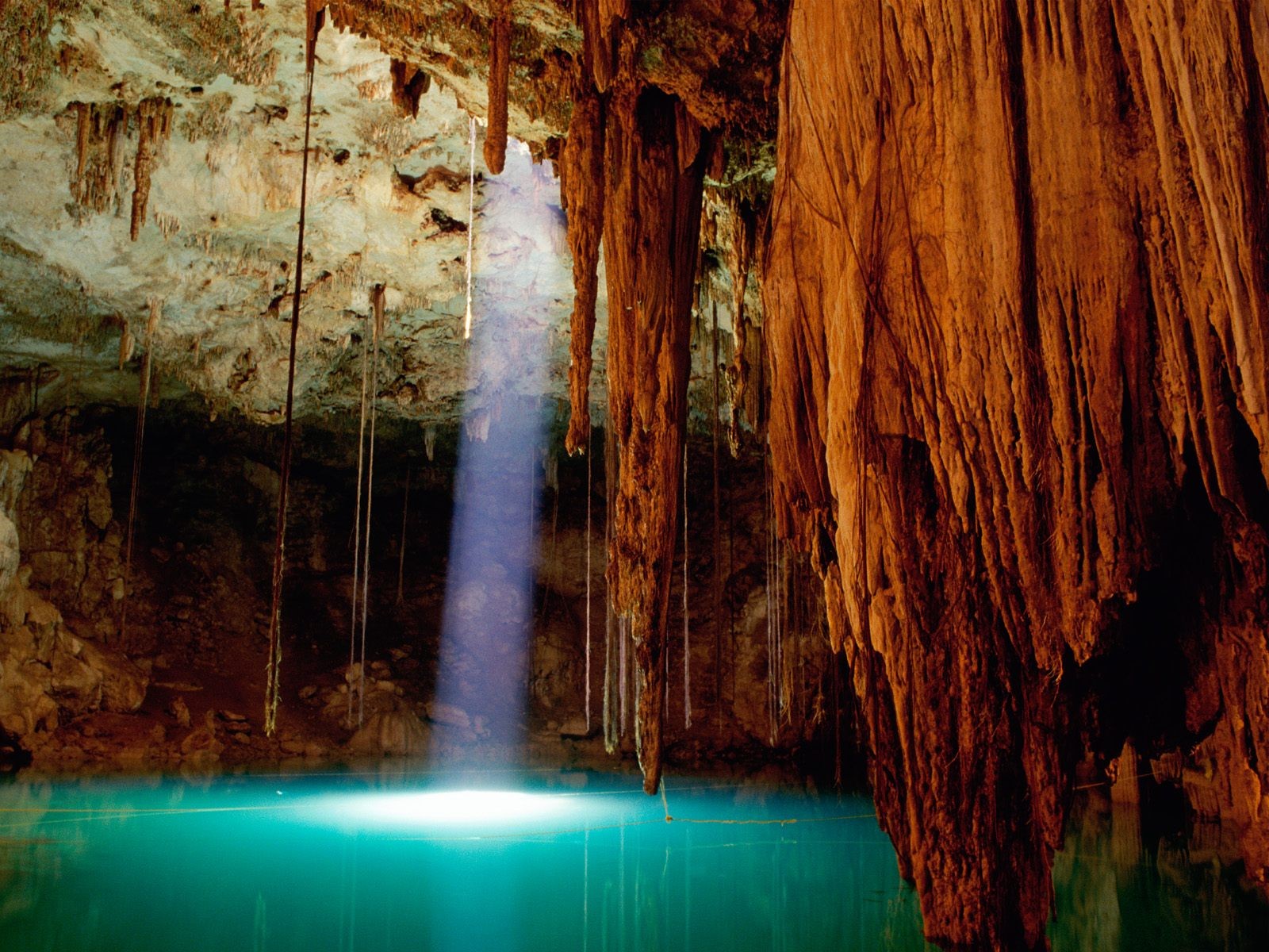 a beam of light stalactites cave