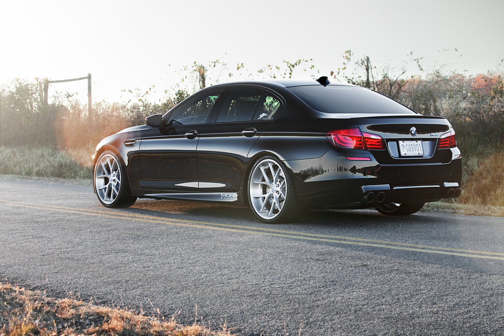 bmw m5 f10 black bmw rear view road marking