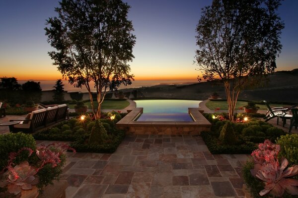 Outdoor swimming pool. Beautiful flowers