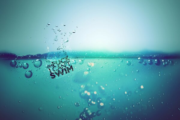 Splash of water on a blue background with bubbles