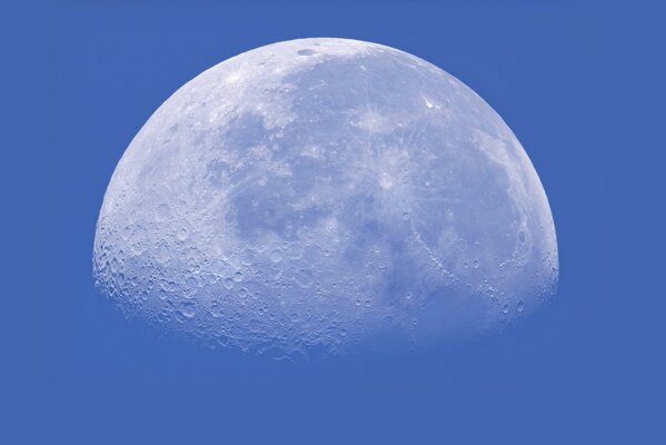 Incomplete Moon on a blue sky background