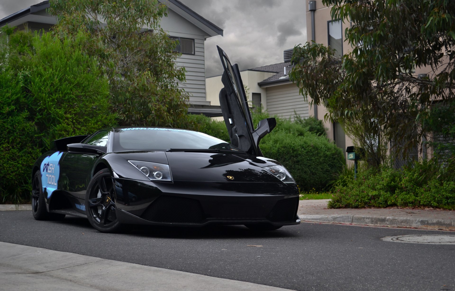 lamborghini murcielago lp560 black lamborghini murcielago front view trees building